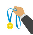 gold medal in hand vector image