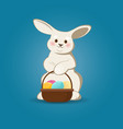 cute easter bunny with easter eggs basket vector image
