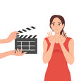 woman movie star is embarrassed sees clapboard vector image