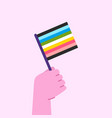 hand holding queer flag pride month concept vector image