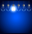 light bulbs on dark blue background vector image vector image