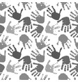 seamless pattern of prints of hands vector image