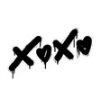 spray painted graffiti xoxo word in black over vector image