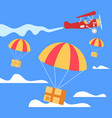parachutes with boxes falling down from airplane vector image