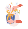 hand unpacking present with decorative bow vector image