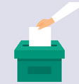 hand puts voting ballot in ballot box election vector image vector image
