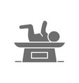 baby on scale weight for infant grey icon vector image